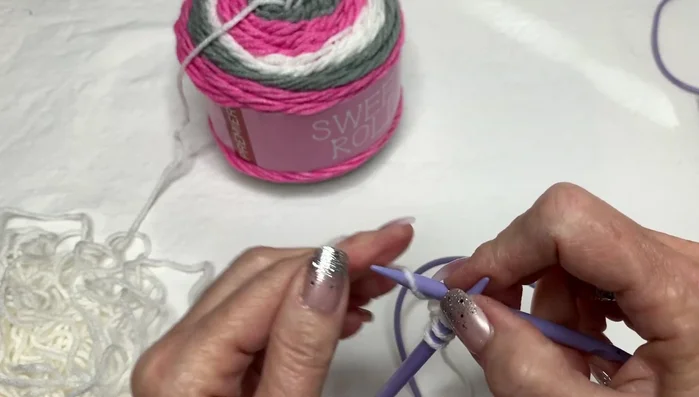 Continue knitting in the garter stitch (knit every row), repeating the eyelet edging at the beginning of each row until desired scarf length is reached.