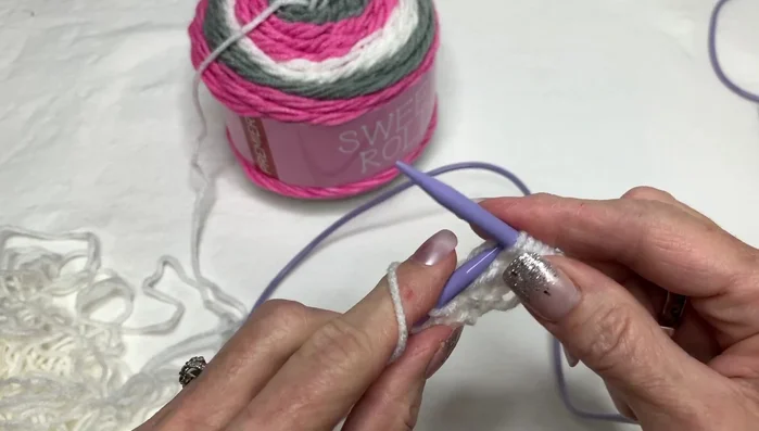 Continue knitting in the garter stitch (knit every row), repeating the eyelet edging at the beginning of each row until desired scarf length is reached.