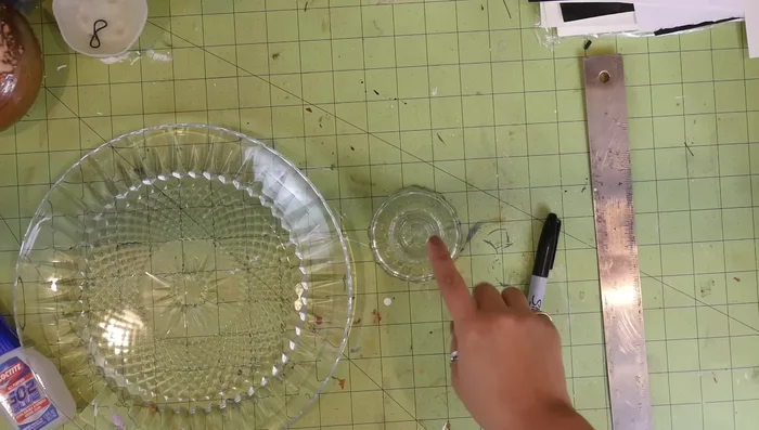 From the center 'X', measure and mark the radius you found earlier, repeating this at several points around the center to create a circle.