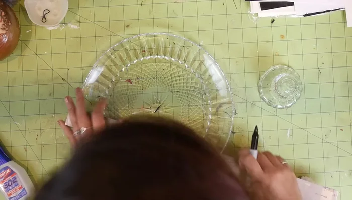 From the center 'X', measure and mark the radius you found earlier, repeating this at several points around the center to create a circle.