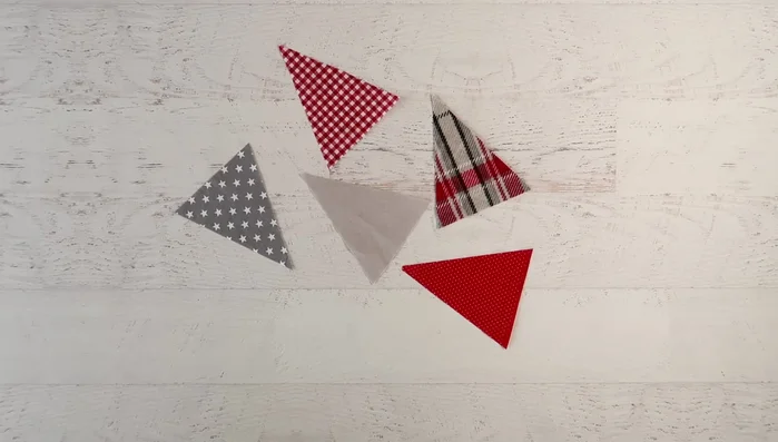 Pin the front and back triangles together and sew along the sides, leaving the top open.