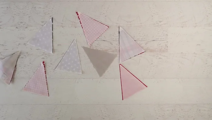Pin the front and back triangles together and sew along the sides, leaving the top open.