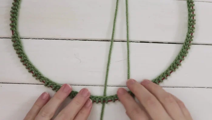 Invisible Join in the Round: Insert the right needle into the first stitch on the left needle from right to left (as if to purl), slip the stitch to the right needle. Knit the next stitch on the right needle and slip it over the first stitch. Repeat this process to join the round.