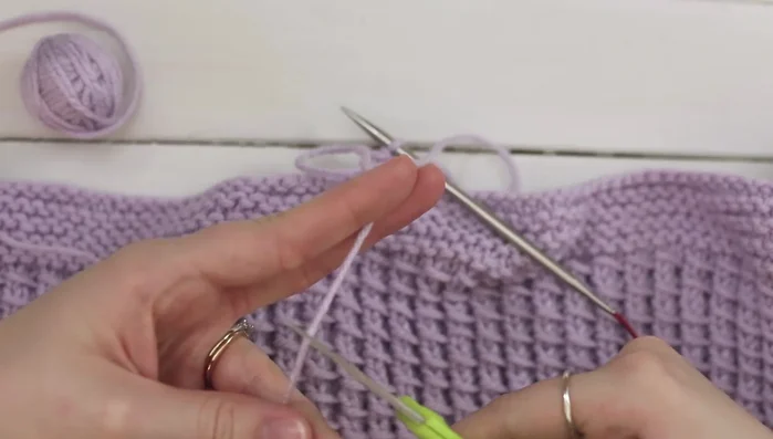 Finishing: Weave in ends. Add a 'fake' stitch to close the gap in the bind off by threading the tail yarn through a yarn needle and going underneath both legs of the bind off V-shape.