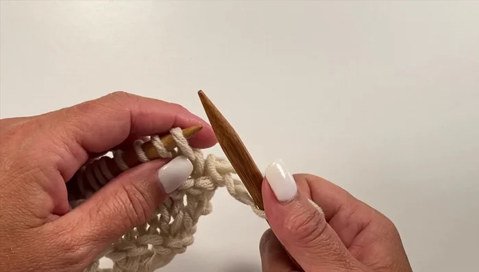 Row 11: Knit one, knit one, yarn over, knit one (all in the same stitch), knit one, repeat across, knit one.