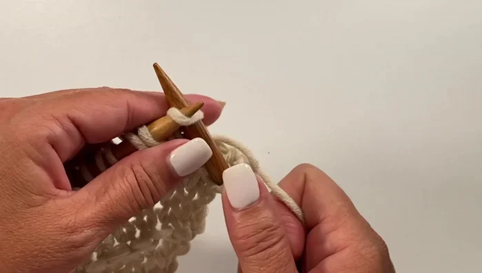 Row 15: Knit two, knit one, yarn over, knit one (all in same stitch), knit two, repeat across, knit one.