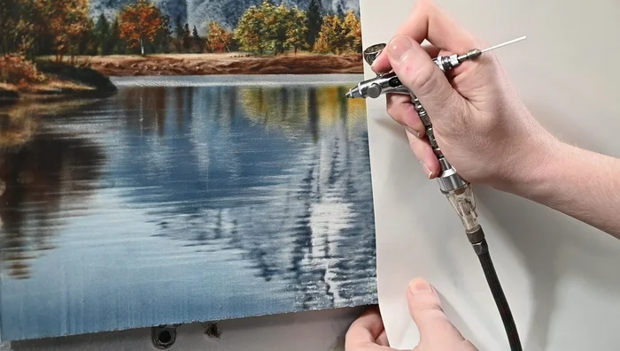 Add more ripples using the eraser. Ensure the reflections mimic the landscape above, adjusting values and hues for a natural look.