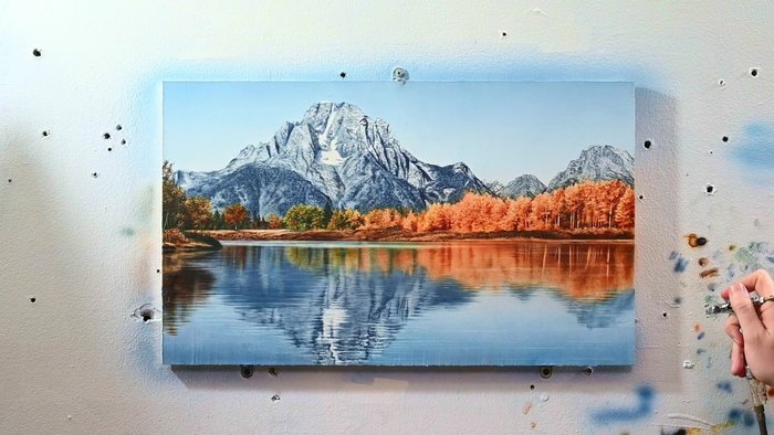 Soften the edges of the land. Add a shadow for a bush using the airbrush. Use an X-Acto blade to create twig-like highlights.