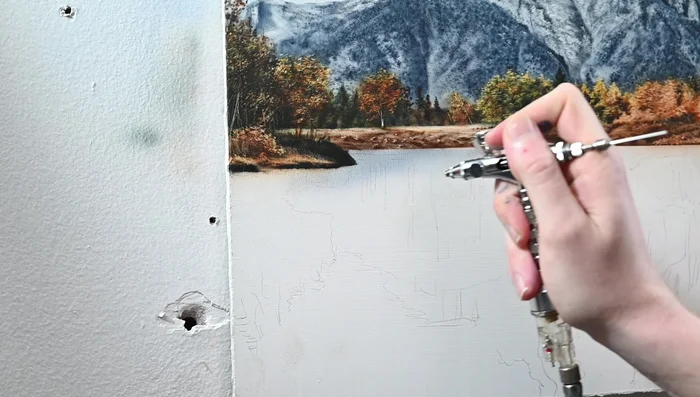 Paint the water reflection, starting with the sky color (Cobalt Blue and Payne's Gray). Cover the gesso and shape the mountain reflection, making it darker.