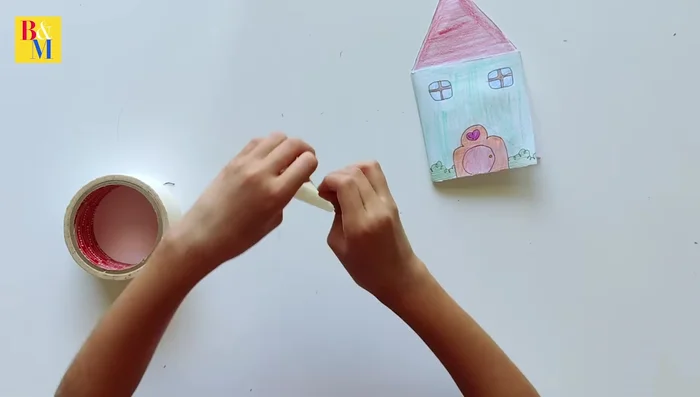 Assemble the house and add the character sticker.