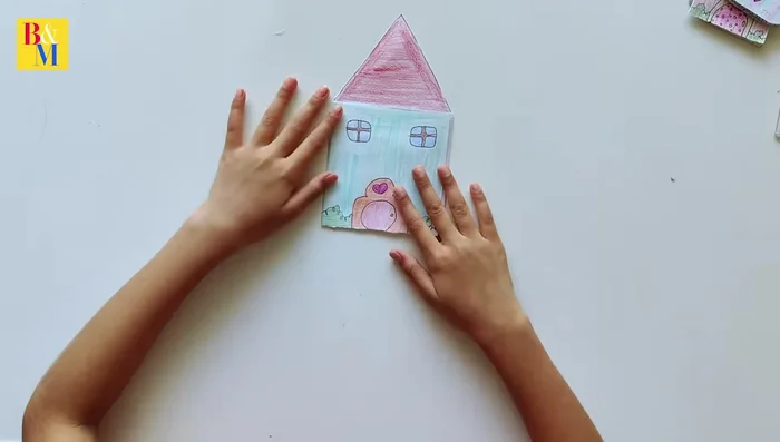 Assemble the house and add the character sticker.