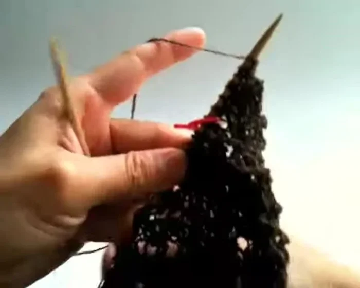 Knit three, purl one (over two yarn overs from previous row), knit two.