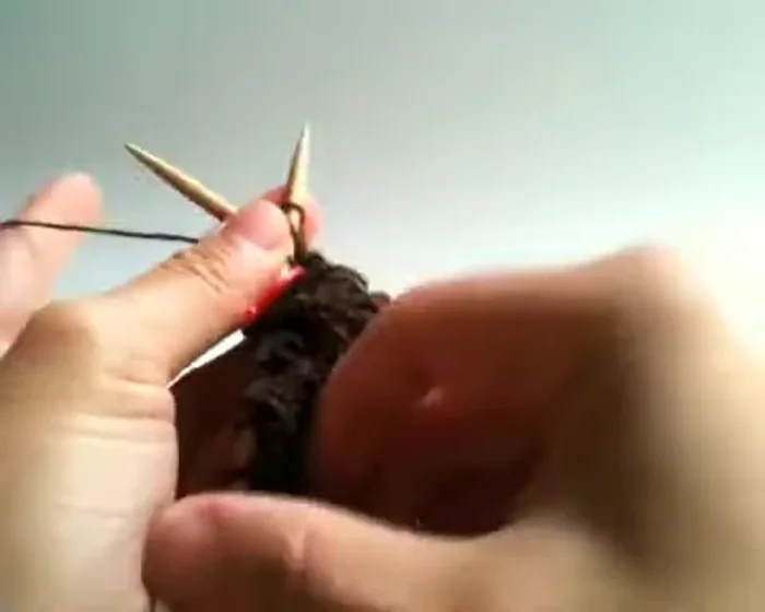 Slide the first stitch and knit to the end.