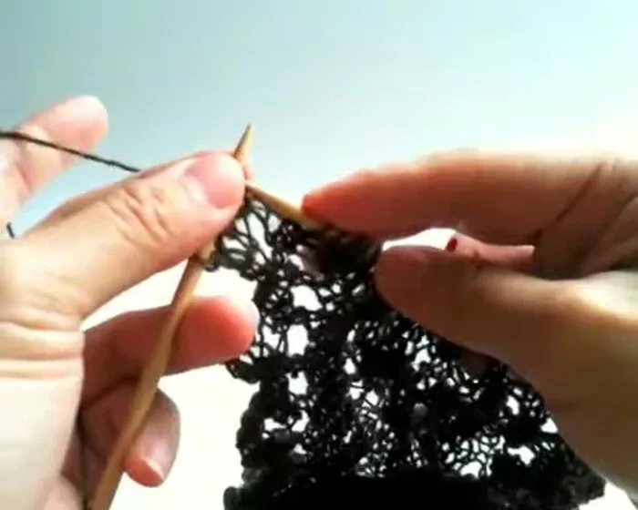 Slide the first stitch and knit to the end.