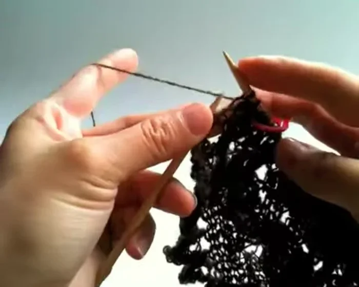 Knit two, yarn over twice, slide, slide, knit, knit to complete row two.