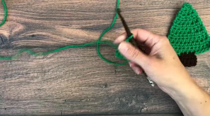 Row 2: Chain one, half double crochet in first stitch, two half double crochets in the next stitch, two half double crochets in the following stitch, one half double crochet in the last stitch (total 4 stitches).