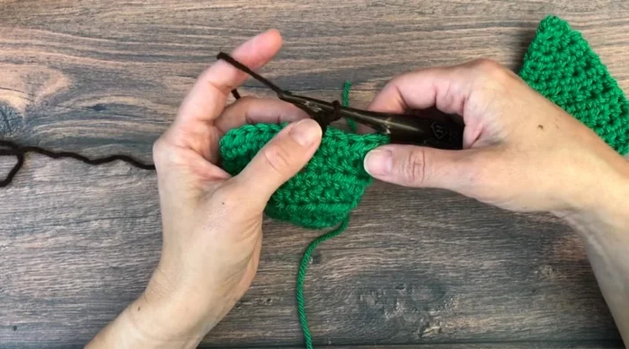 Turn, chain one, and half double crochet in each of the next three stitches to complete the trunk.