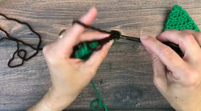 Turn, chain one, and half double crochet in each of the next three stitches to complete the trunk.