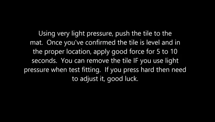 Apply adhesive to the wall and carefully position the bottom section of the backsplash, ensuring consistent spacing. Use spacers under glass tiles to maintain levelness.