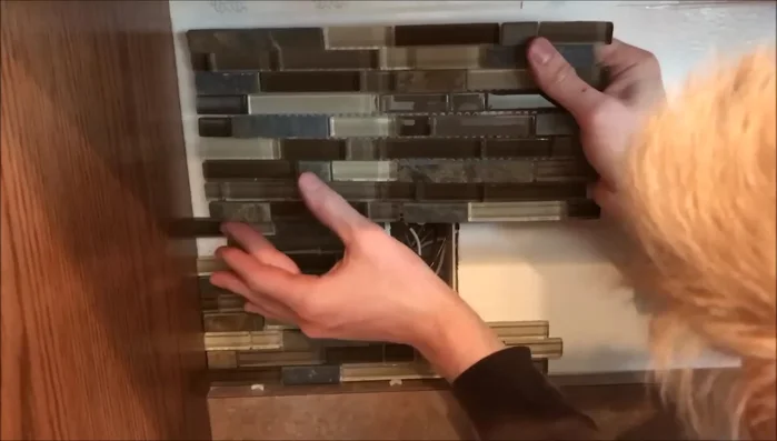 Remove excess tile rows if needed, such as when installing near a microwave. Tiles are easily removed and repositioned.