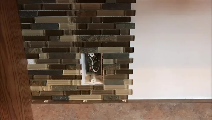 Remove excess tile rows if needed, such as when installing near a microwave. Tiles are easily removed and repositioned.