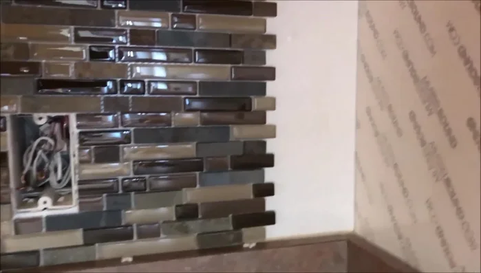 Install the top row, possibly trimming pieces to achieve the desired fit and spacing. Pay attention to starting and stopping points to avoid excessive cutting of small pieces.