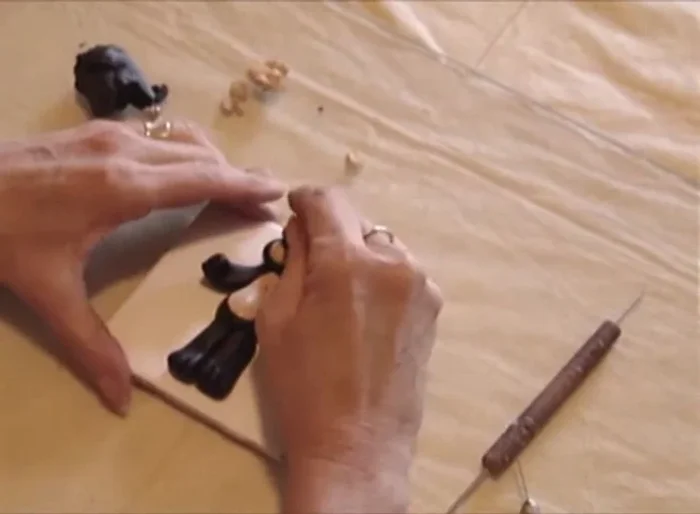 Add a small black ball for the nose.