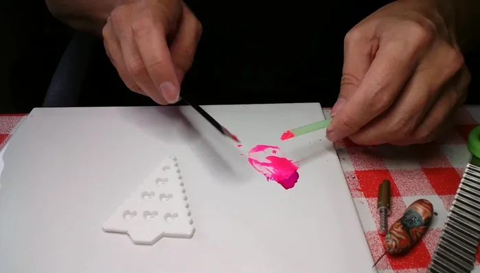 Apply liquid clay into holes using the straw.