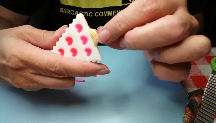 Apply glaze and attach ribbon for hanging.