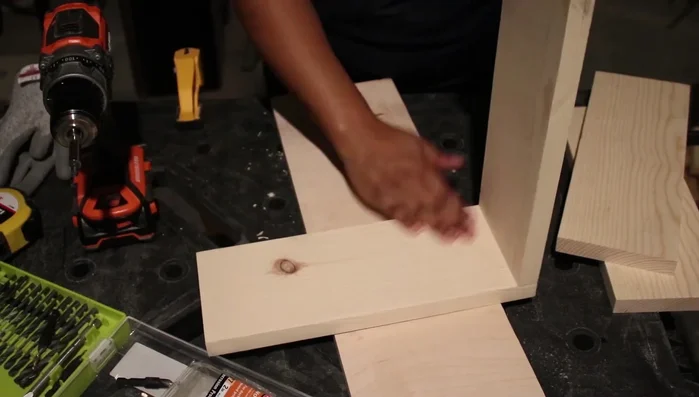 Connect the L-shapes: Connect the two L-shapes to form a square cube.