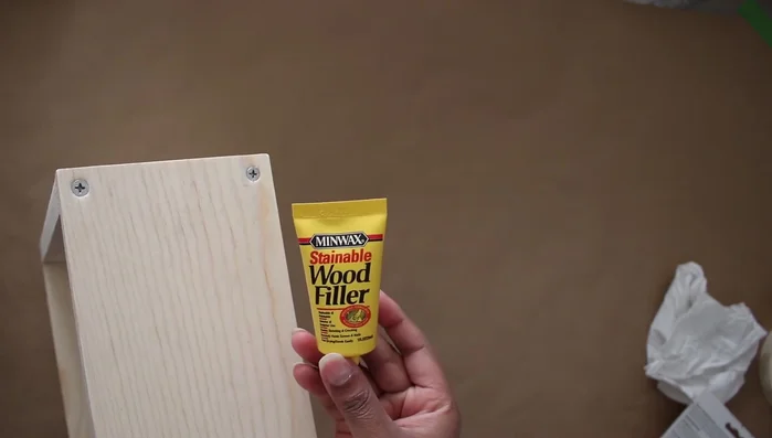 Finish the shelves: Fill screw holes with wood filler, sand smooth, and paint.