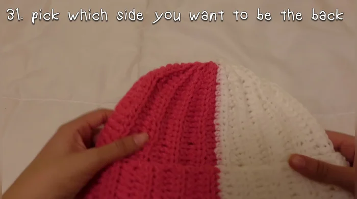 Sew the ears onto the hat.