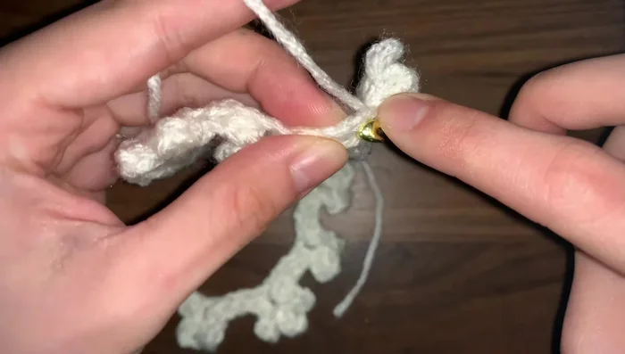 Work your way back along the foundation chain, creating flowers with alternating numbers of petals (two then three, etc.).