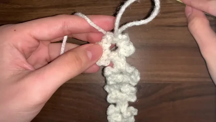 Finish the last flower and fasten off, leaving a long tail to tie or attach a clasp.