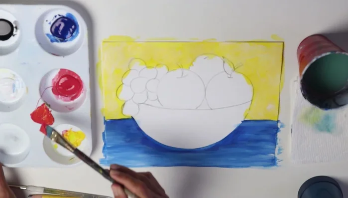 Mix yellow and blue to create green and paint the leaves.