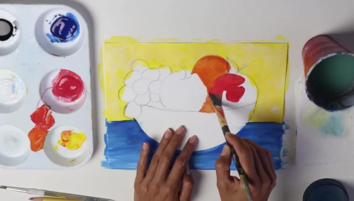 Mix yellow and blue to create green and paint the leaves.