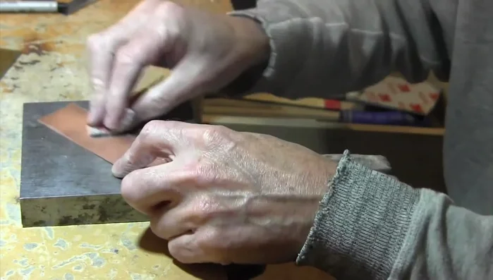 Lightly sand the copper surface using a 3M medium sanding sponge.