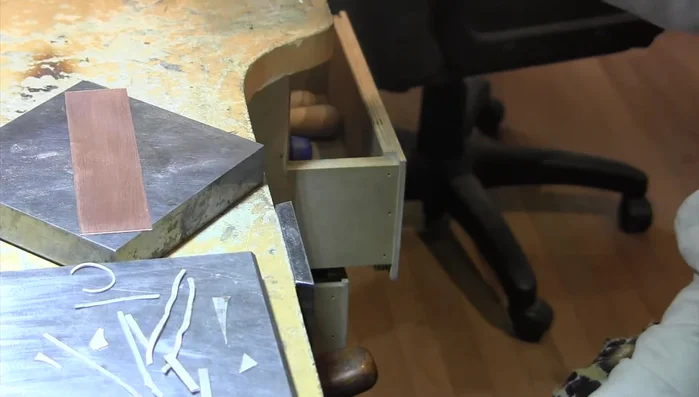 Melt the silver onto the copper using a soldering torch, ensuring even coverage and a good layer on the edges.