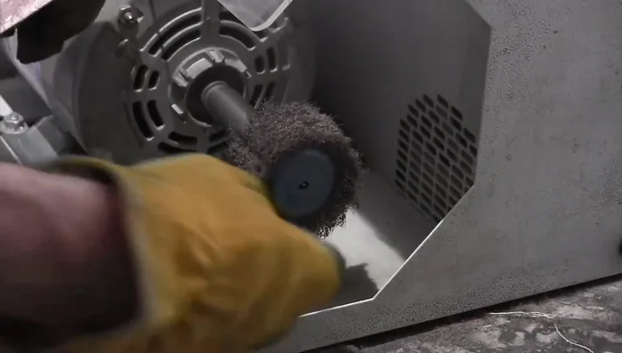 Use an aggressive brush wheel to remove any remaining copper oxidation.