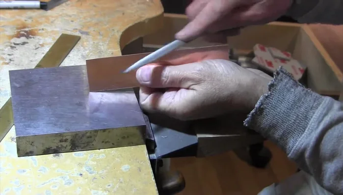 Lightly sand the copper surface using a 3M medium sanding sponge.