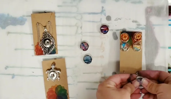 Snap the finished charms into the desired jewelry base (necklaces, earrings, bracelets, etc.).