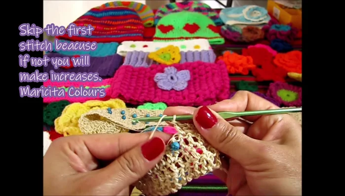 Continue the pattern, alternating bead rows and plain double crochet rows until the desired length is reached.