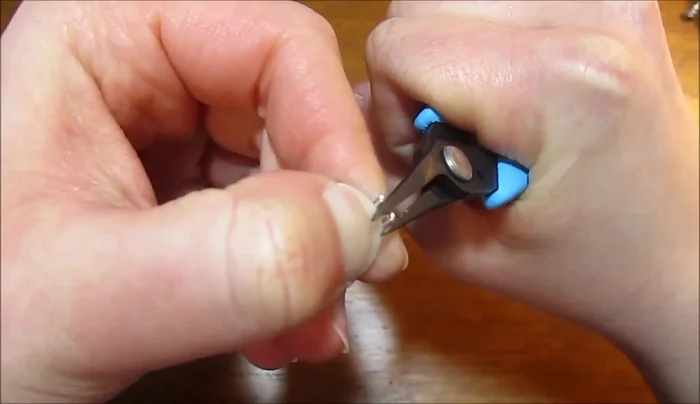 Gently widen the points using round nose pliers to create petal shapes.