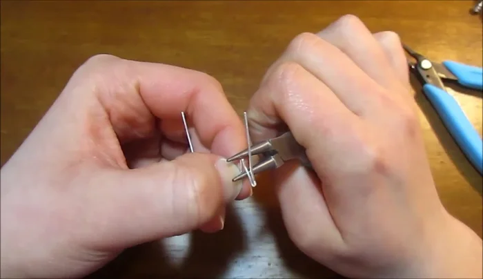 Gently widen the points using round nose pliers to create petal shapes.