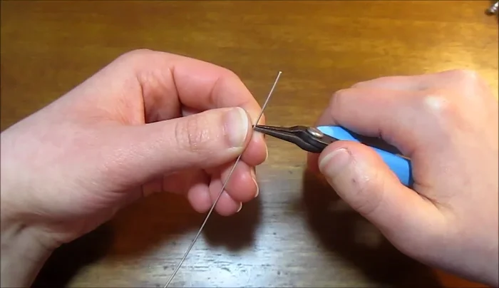 Gently widen the points using round nose pliers to create petal shapes.