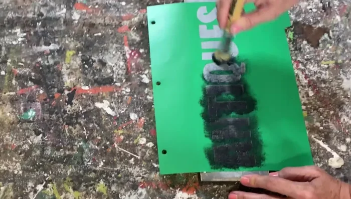 Carefully peel off the stencil while the paint is still wet to avoid smearing.