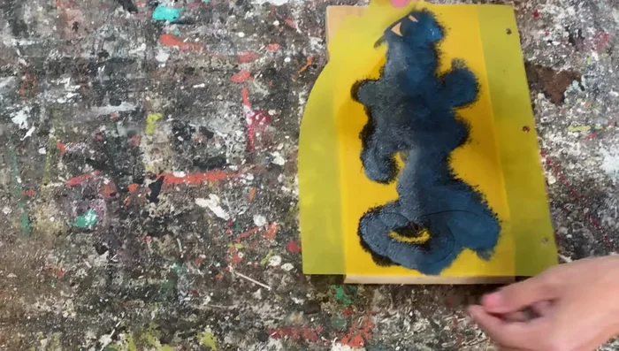 Carefully peel off the stencil while the paint is still wet to avoid smearing.