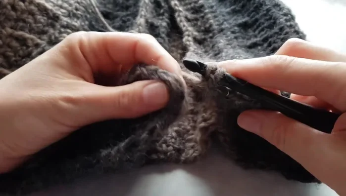 Yarn over and pull through all loops to secure the first stitch.