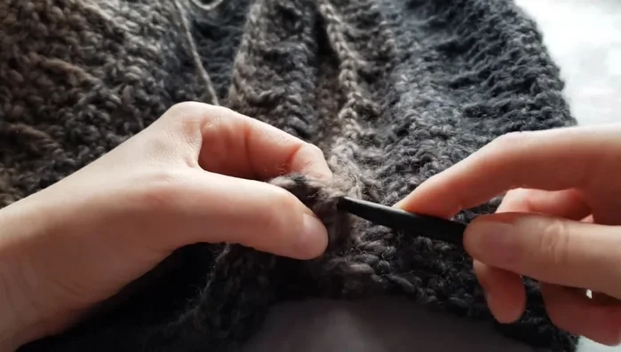 Yarn over and pull through all loops to secure the first stitch.