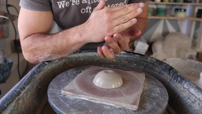 Use your fingers to further refine the shape, ensuring it's about ½ to ¾ inch thick in the center.